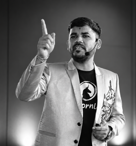 Mayur Soni addressing an audience with a headset microphone